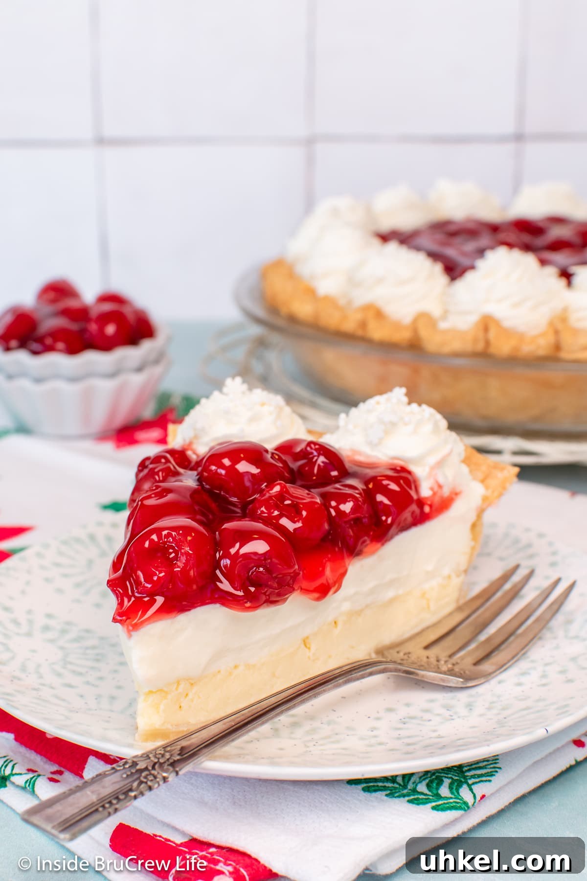 Classic Cherry Cream Cheese Pie Recipe 2 A slice of Cherry cheesecake pie on a plate.