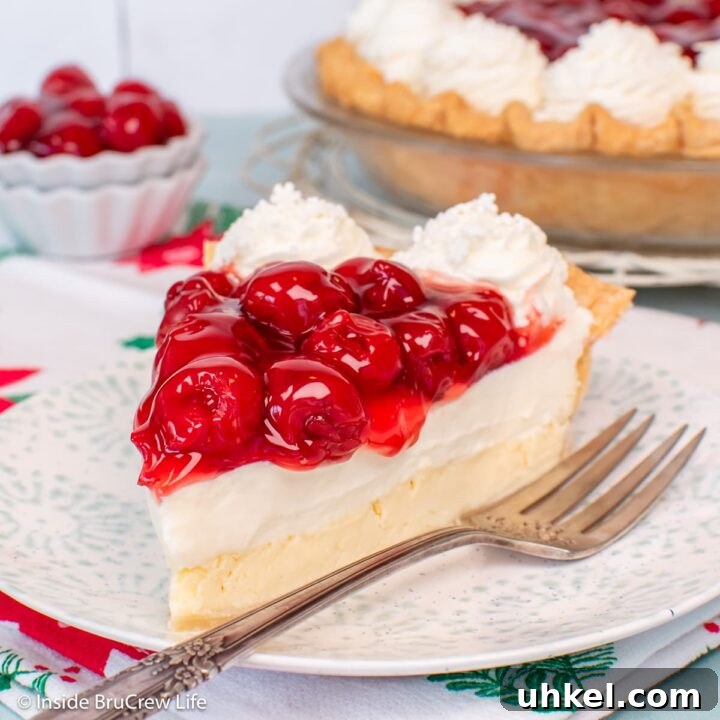 A slice of Cherry cheesecake pie on a plate.