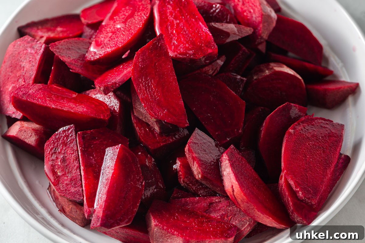 Air Fryer Roasted Beets with Crispy Edges 4 sliced beets in a bowl.
