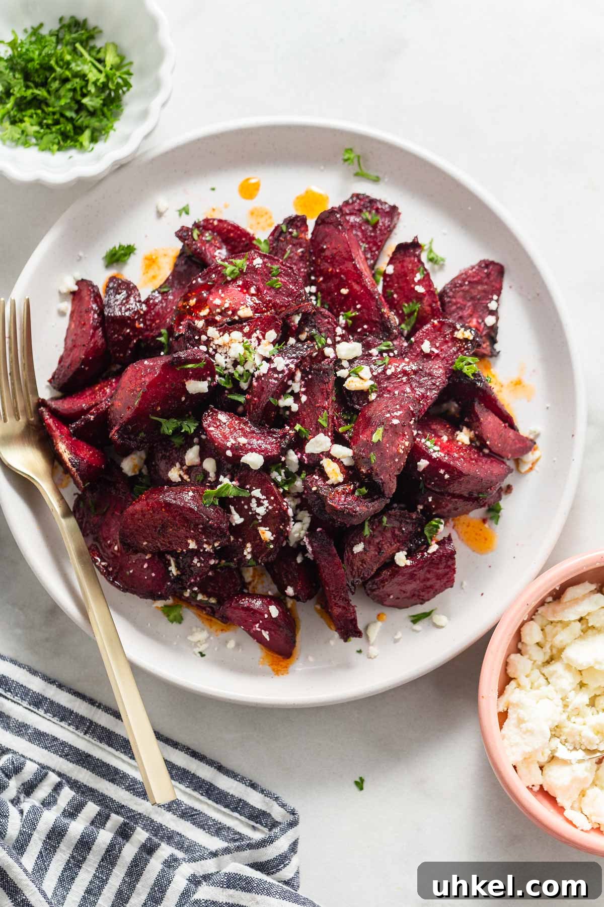 Air Fryer Roasted Beets with Crispy Edges 9 air fryer roasted beets on a plate with feta cheese.