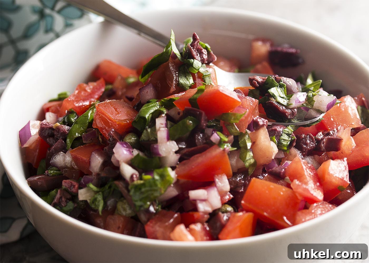 Italian Tomato, Olive and Caper Salsa Recipe 3 Italian salsa close-up with tomatoes and basil