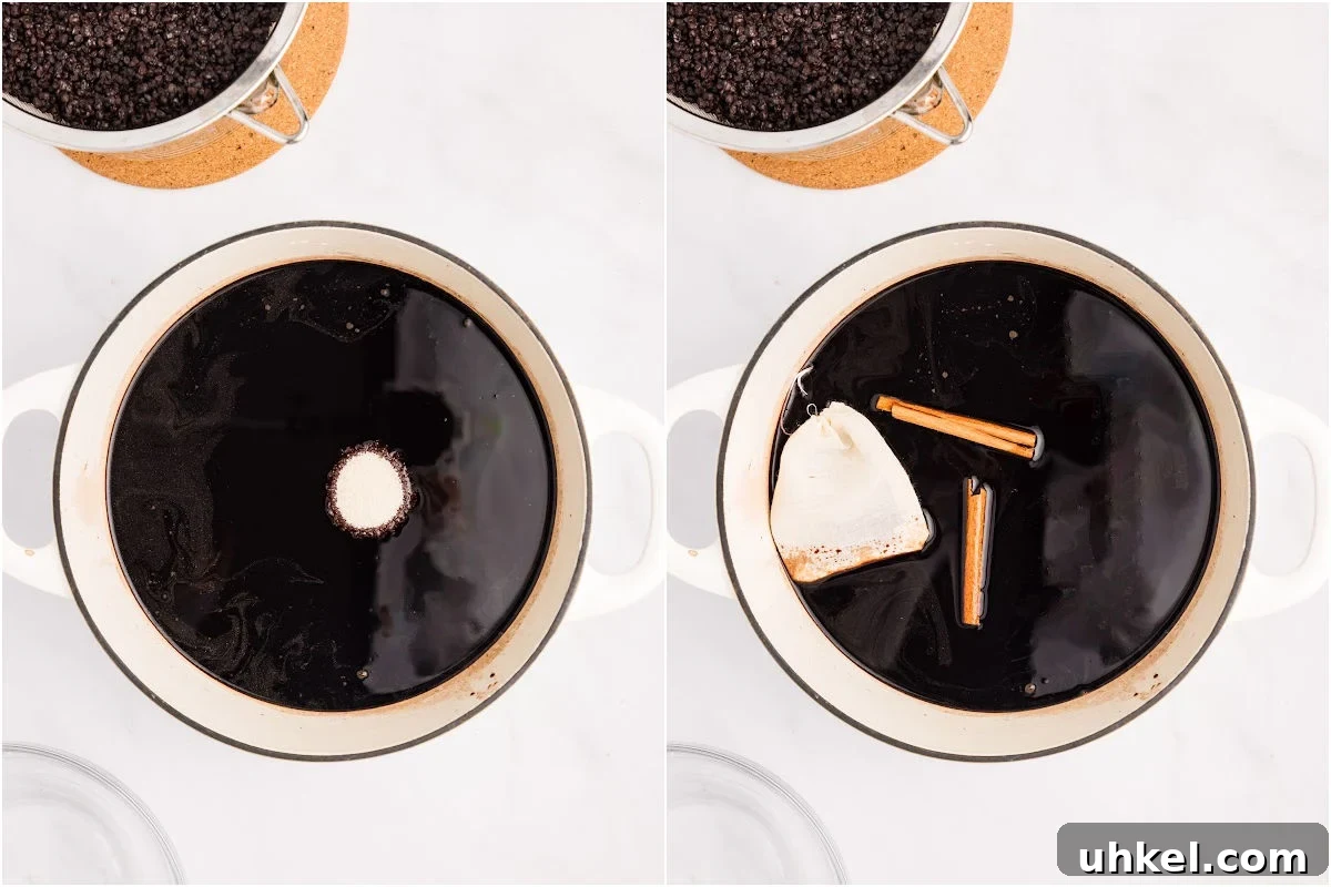 Spiced Elderberry Syrup: Step-by-Step Canning Instructions 6 sugar, cinnamon, and tea bag of cloves added to pot of elderberry liquid.