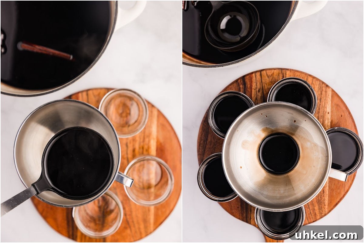 Spiced Elderberry Syrup: Step-by-Step Canning Instructions 8 jars being filled with syrup with ladle and funnel.