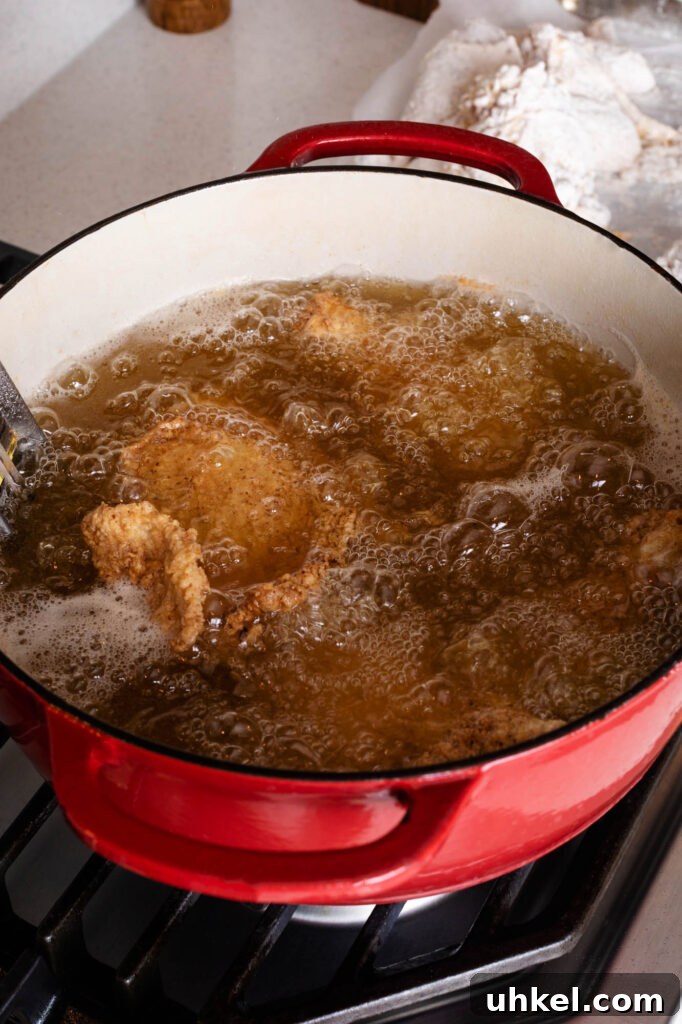Crispy Fried Chicken Without Buttermilk 11 frying chicken in a dutch oven