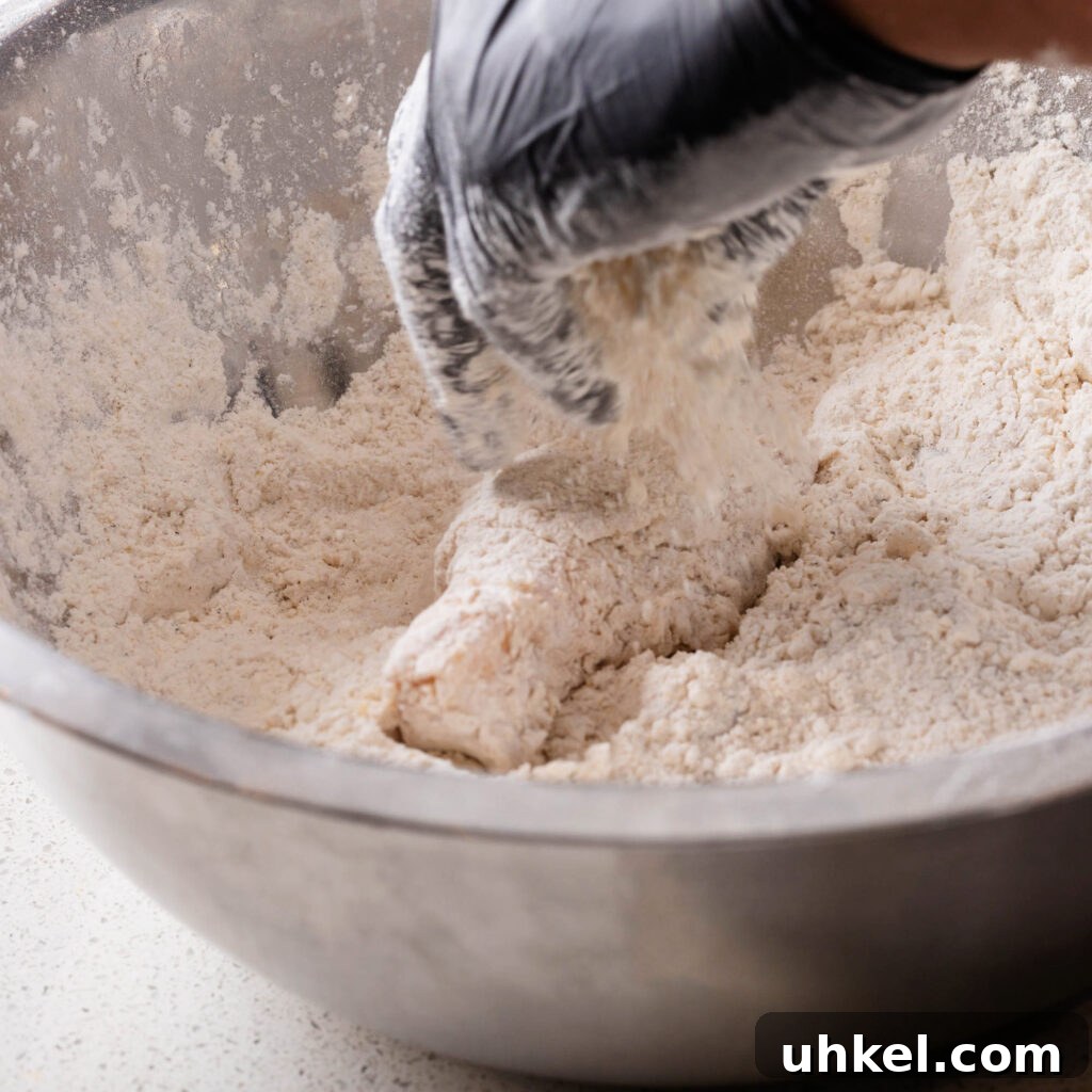 Crispy Fried Chicken Without Buttermilk 7 dredging chicken pieces in seasoned flour