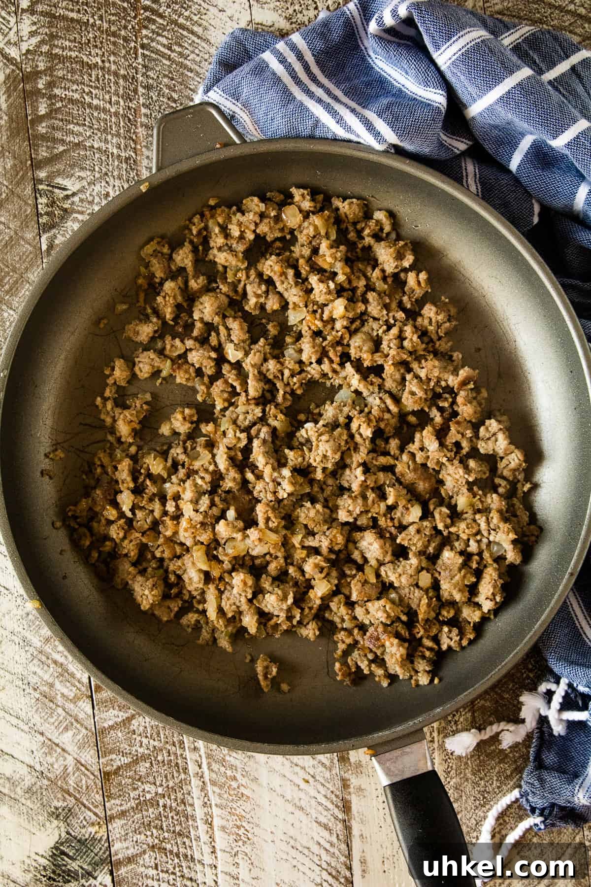Smoked Queso Dip Recipe with Roasted Peppers and Chipotle 4 Cooked ground sausage in skillet.
